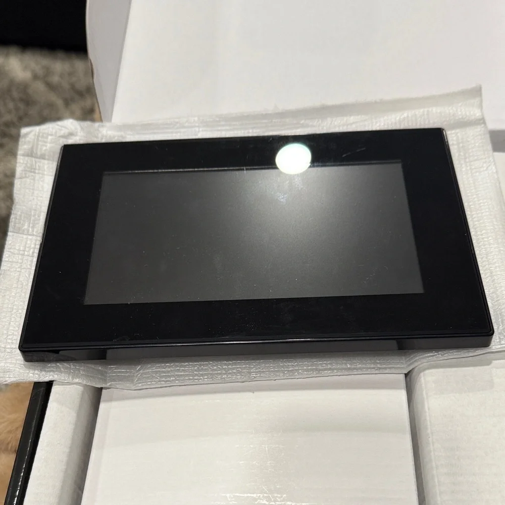 New digital 7” full function black acrylic photo frame with stand -Easy to use.